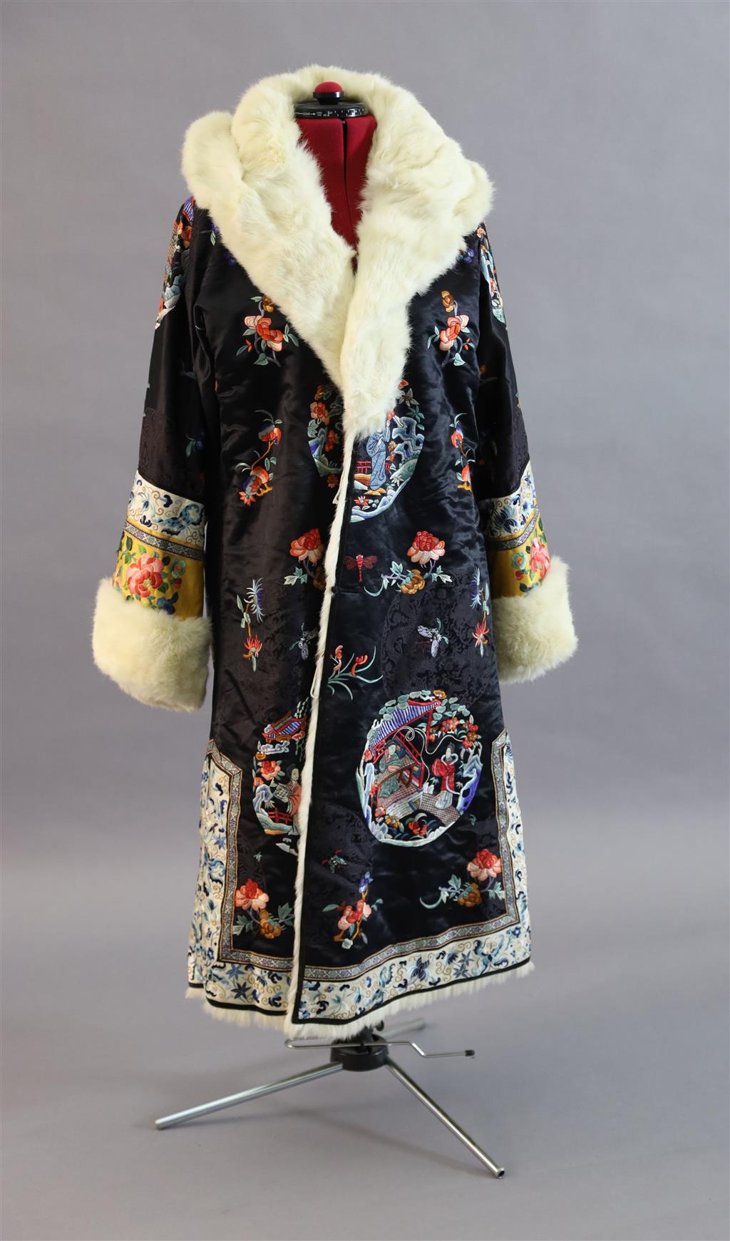 A Chinese silk embroidered winter robe, late 19th century/early 20th century, length 125cm